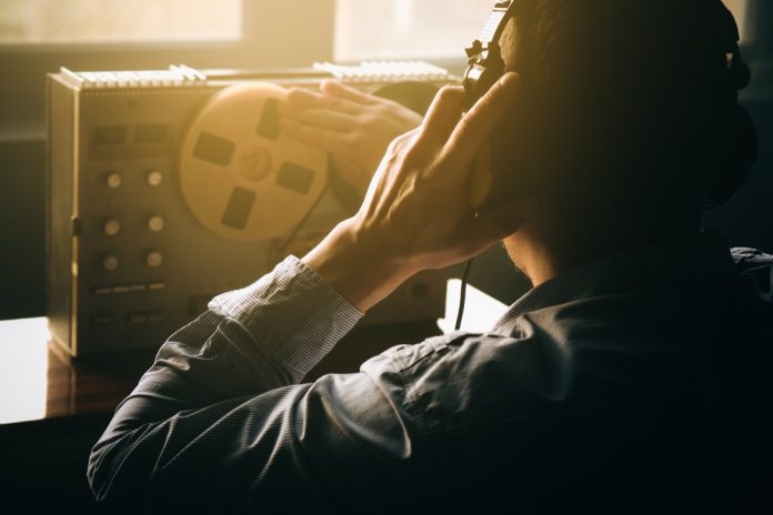 Secret,Agent,Listens,On,The,Reel,Tape,Recorder.,Officer,Wiretapping judge recording