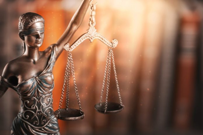 Statue,Of,Justice,And,Book.