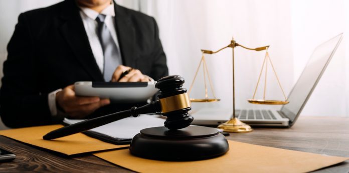 Justice,And,Law,Concept.male,Judge,In,A,Courtroom,On,Wooden