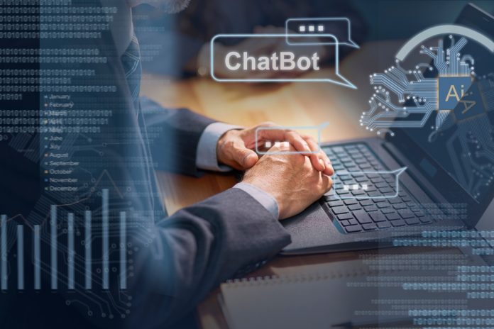 Man,Sitting,At,Desk,Chatting,With,An,Ai,Chatbot,Using