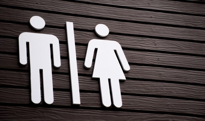 Restroom,Sign,On,A,Toilet,Door,on,Wood,Background.toilet,Sign,-